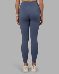 Woman wearing Elixir Ultra High-Rise Full Length Legging Pockets - Night Shadow | Model:Phoebe | Size:S