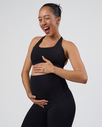 Woman wearing Elixir Ultra High-Rise Maternity Full Length Legging Pockets - Black | Model:Kitahna | Size:S