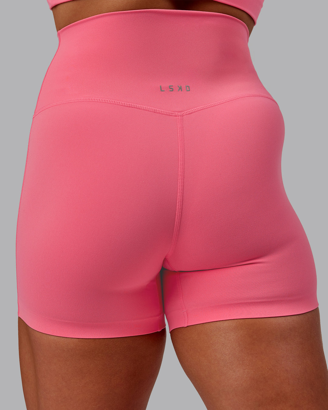 Woman wearing Elixir Ultra High-Rise 4&quot; Short - Pink Lemonade | Model:Amber | Size:S