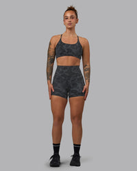 Woman wearing Elixir Ultra High-Rise 4" Short Pockets - Tranquil-Black | Model:Robyn | Size:S
