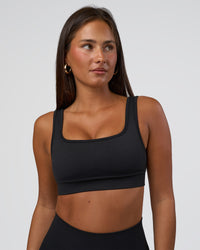 Woman wearing Ember Seamless Sports Bra - Black | Model:Brylee | Size:XS