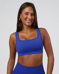 Woman wearing Ember Seamless Sports Bra - Power Cobalt | Model:Bianca | Size:S