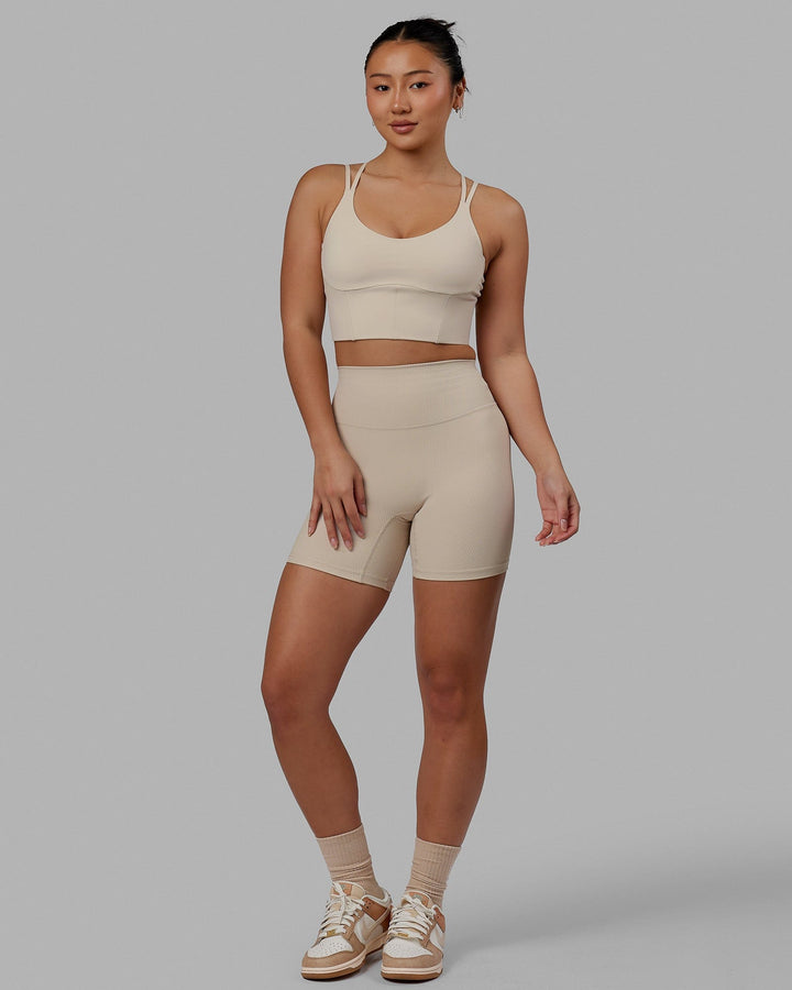 Woman wearing Empower Corset Bra - Shale Beige