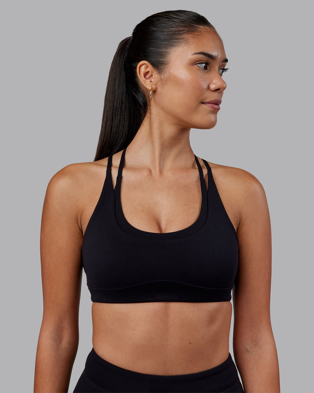 Woman wearing Empower Sports Bra - Black | Model:Rhiley | Size:S