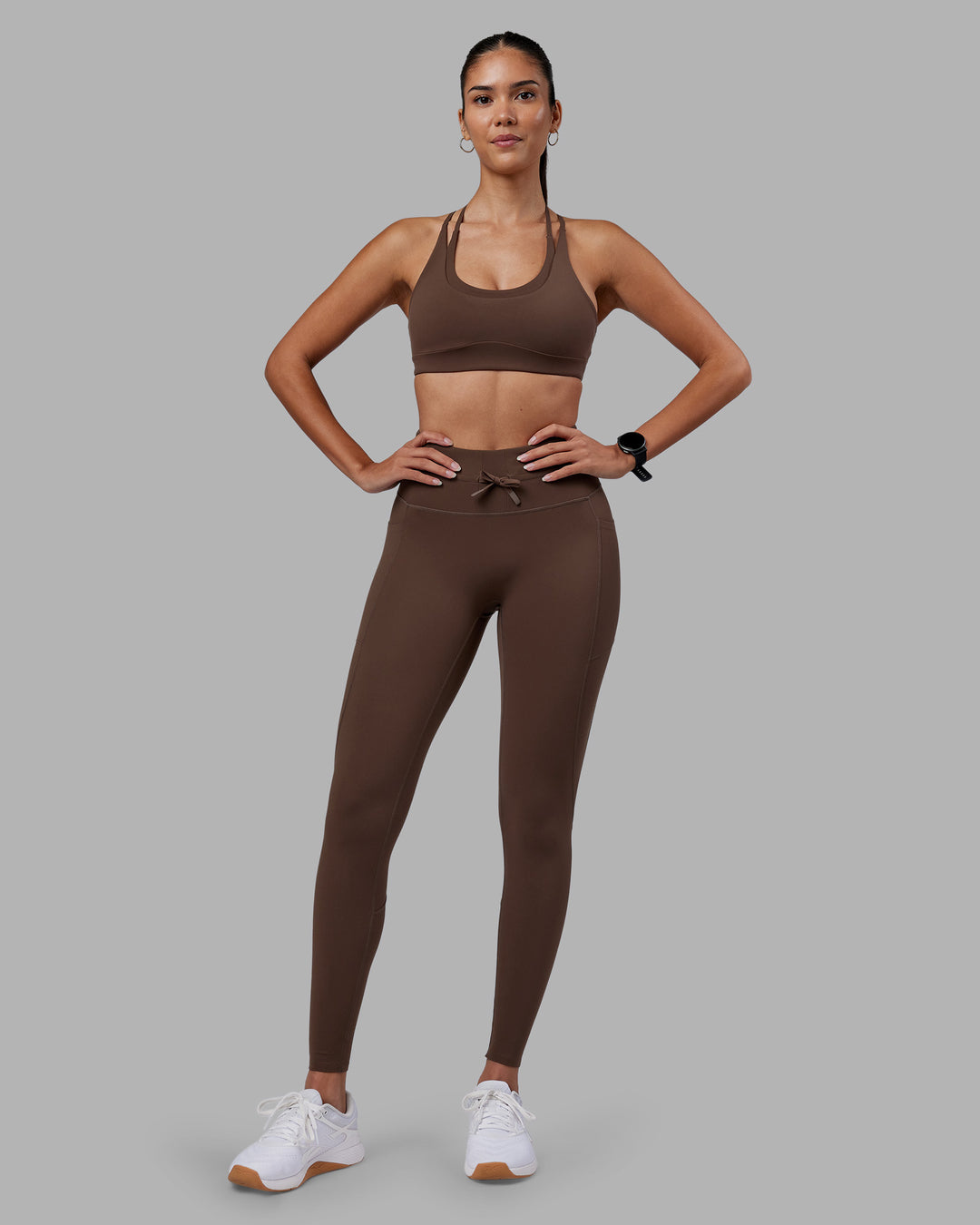 Woman wearing Empower Sports Bra - Chocolate Martini | Model:Rhiley | Size:S
