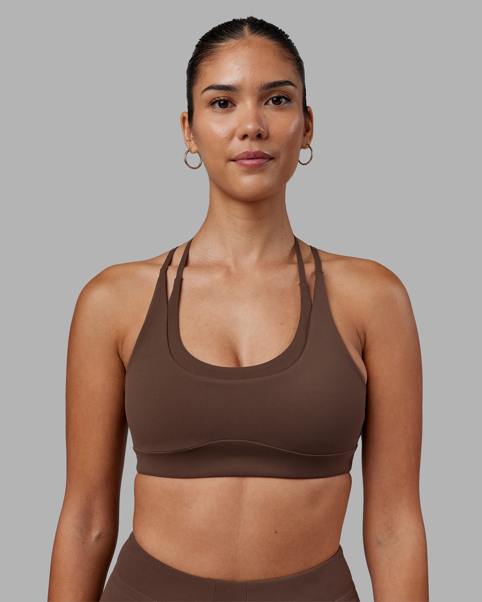Woman wearing Empower Sports Bra - Chocolate Martini | Model:Rhiley | Size:S