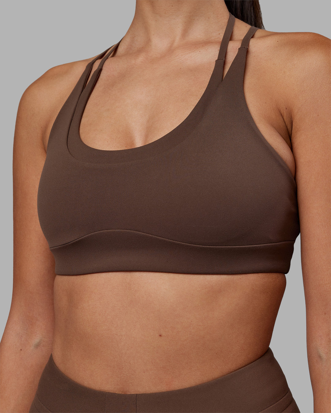 Woman wearing Empower Sports Bra - Chocolate Martini | Model:Rhiley | Size:S