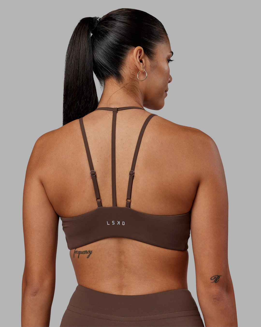 Woman wearing Empower Sports Bra - Chocolate Martini | Model:Rhiley | Size:S