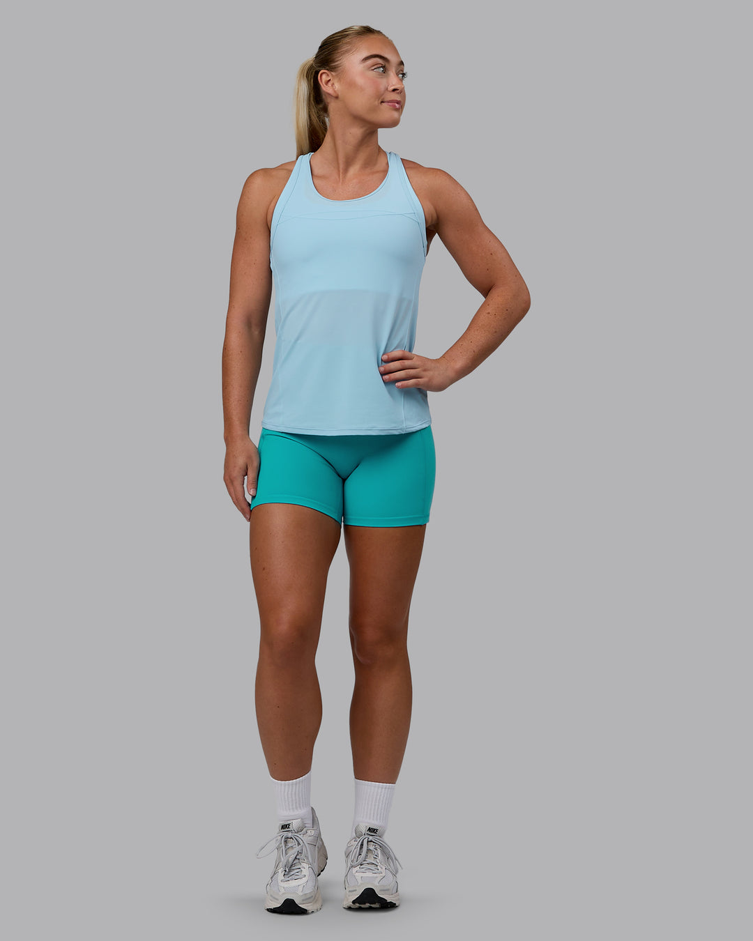Woman wearing Endorphin Rush Tank - Glacial Blue