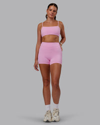 Woman wearing Enhance Ultra High-Rise 4" Short - Pink Frosting | Model:Phoebe | Size:S