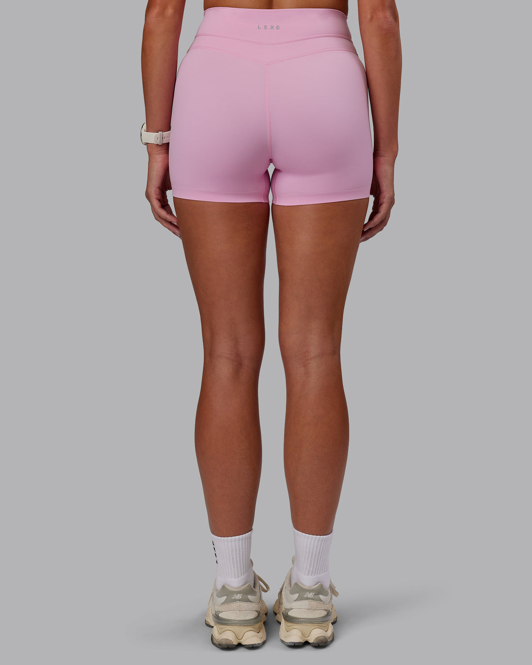 Woman wearing Enhance Ultra High-Rise 4&quot; Short - Pink Frosting | Model:Phoebe | Size:S
