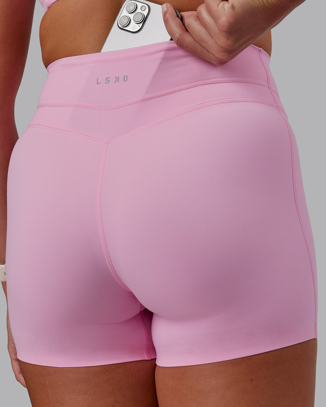 Woman wearing Enhance Ultra High-Rise 4&quot; Short - Pink Frosting | Model:Phoebe | Size:S