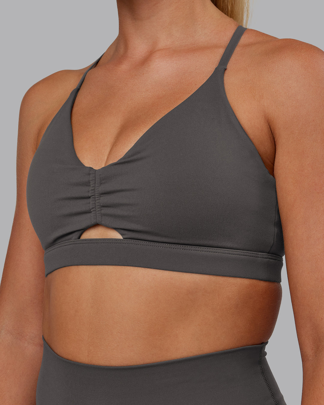 Woman wearing Essence Sports Bra - Dark Storm | Model:Hannah | Size:S