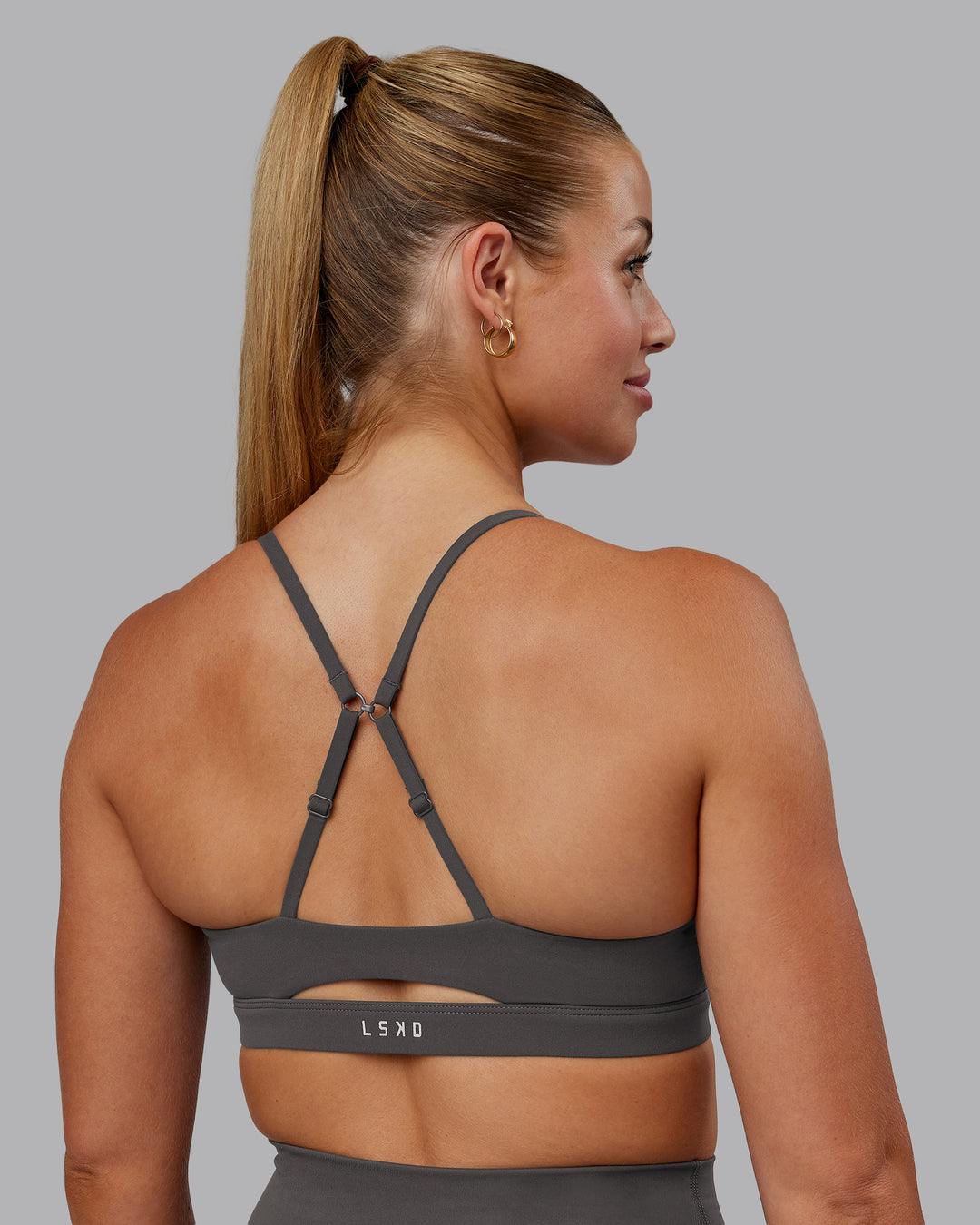 Woman wearing Essence Sports Bra - Dark Storm | Model:Hannah | Size:S