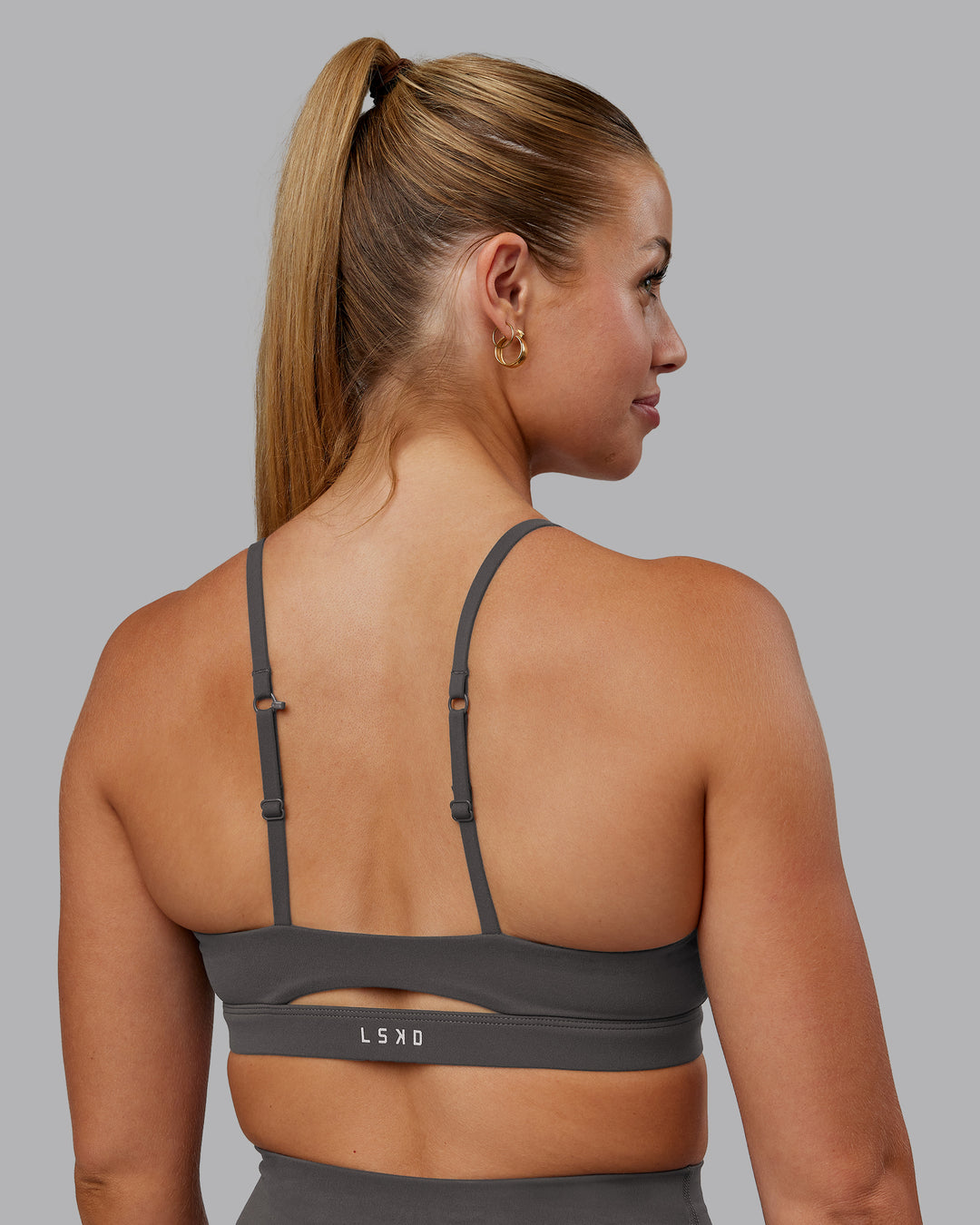 Woman wearing Essence Sports Bra - Dark Storm | Model:Hannah | Size:S