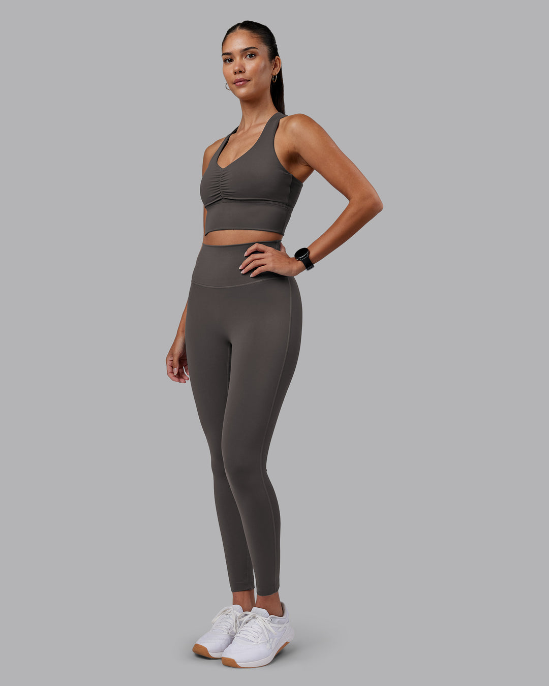 Woman wearing Evoke Longline Sports Bra - Dark Storm | Model:Rhiley | Size:S