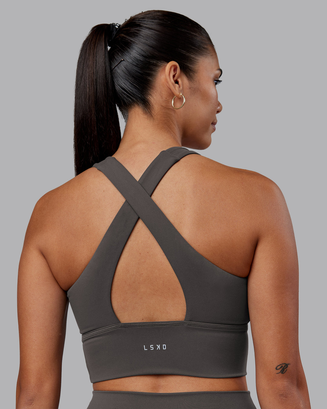 Woman wearing Evoke Longline Sports Bra - Dark Storm | Model:Rhiley | Size:S