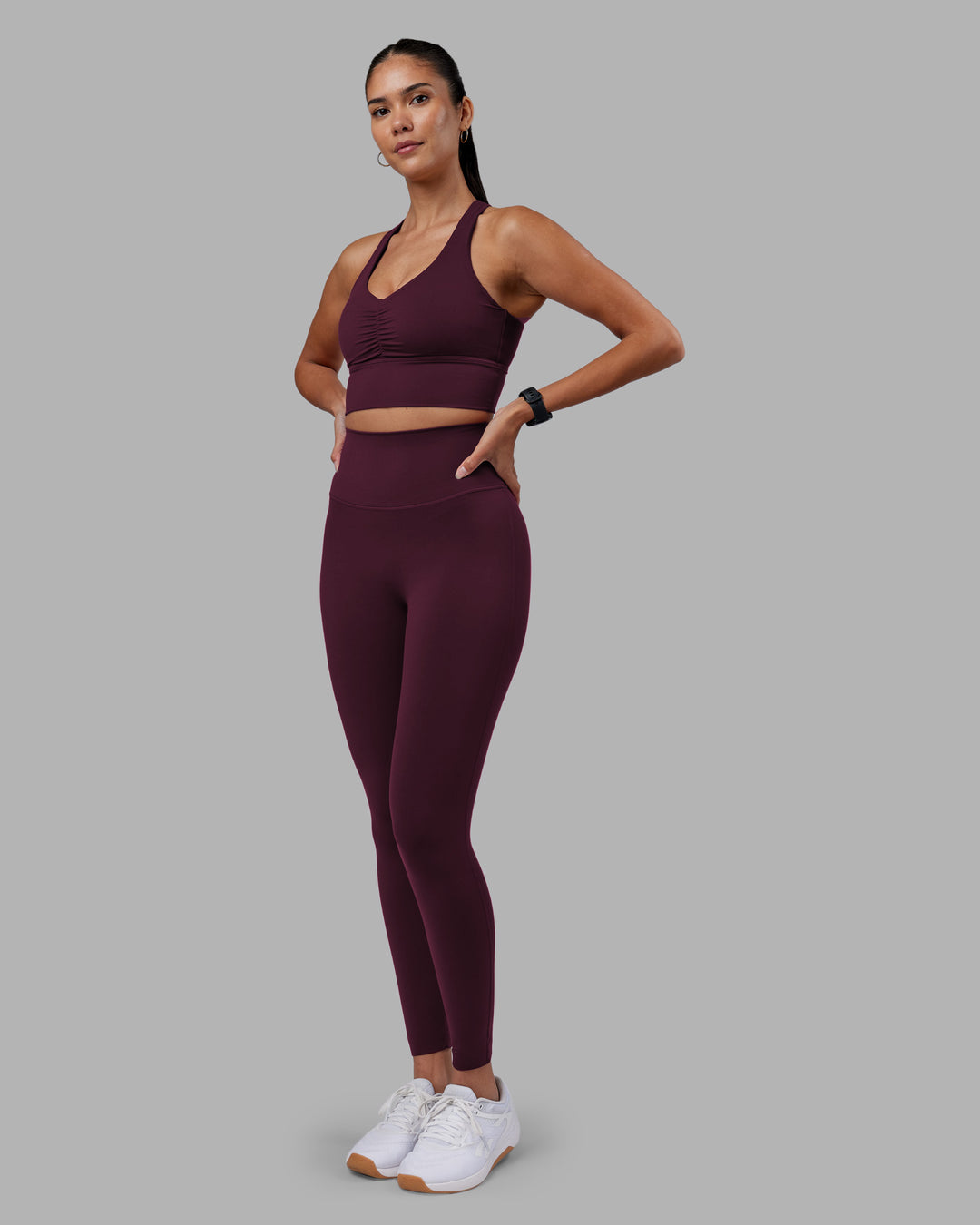 Woman wearing Evoke Longline Sports Bra - Cherry Lacquer | Model:Rhiley | Size:S