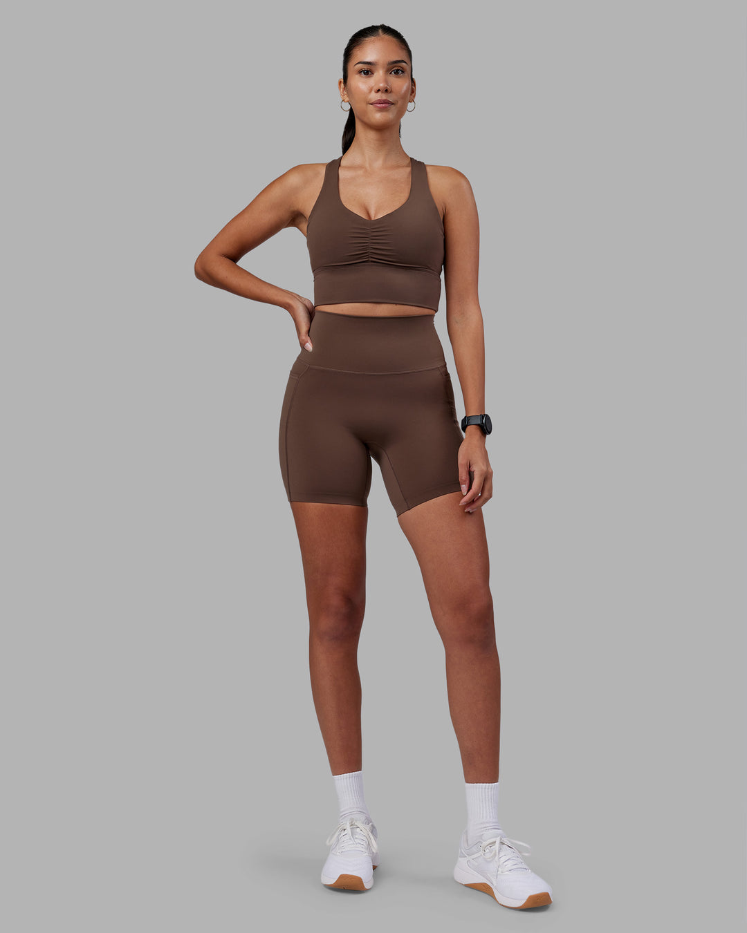 Woman wearing Evoke Longline Sports Bra - Chocolate Martini | Model:Rhiley | Size:S