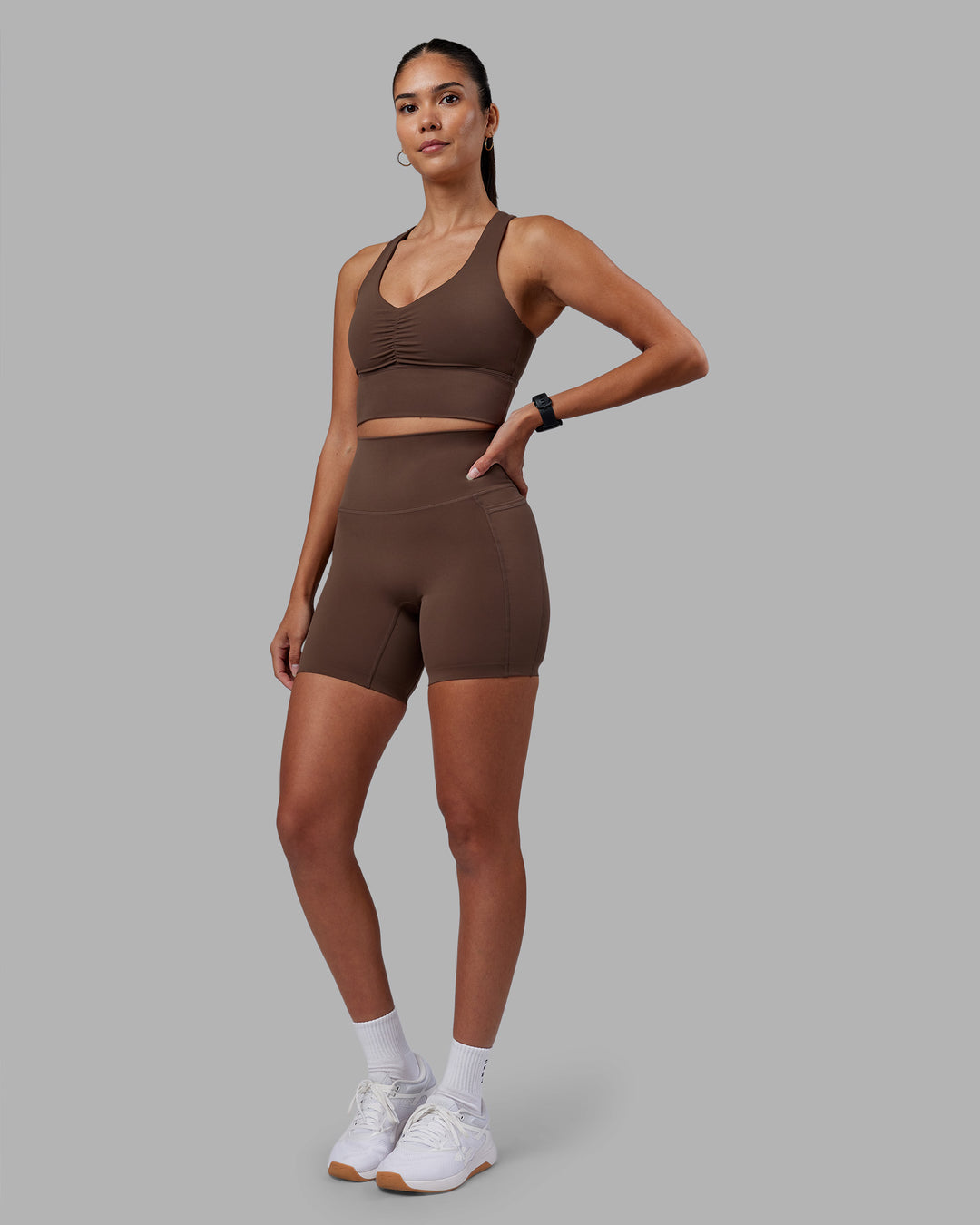 Woman wearing Evoke Longline Sports Bra - Chocolate Martini | Model:Rhiley | Size:S