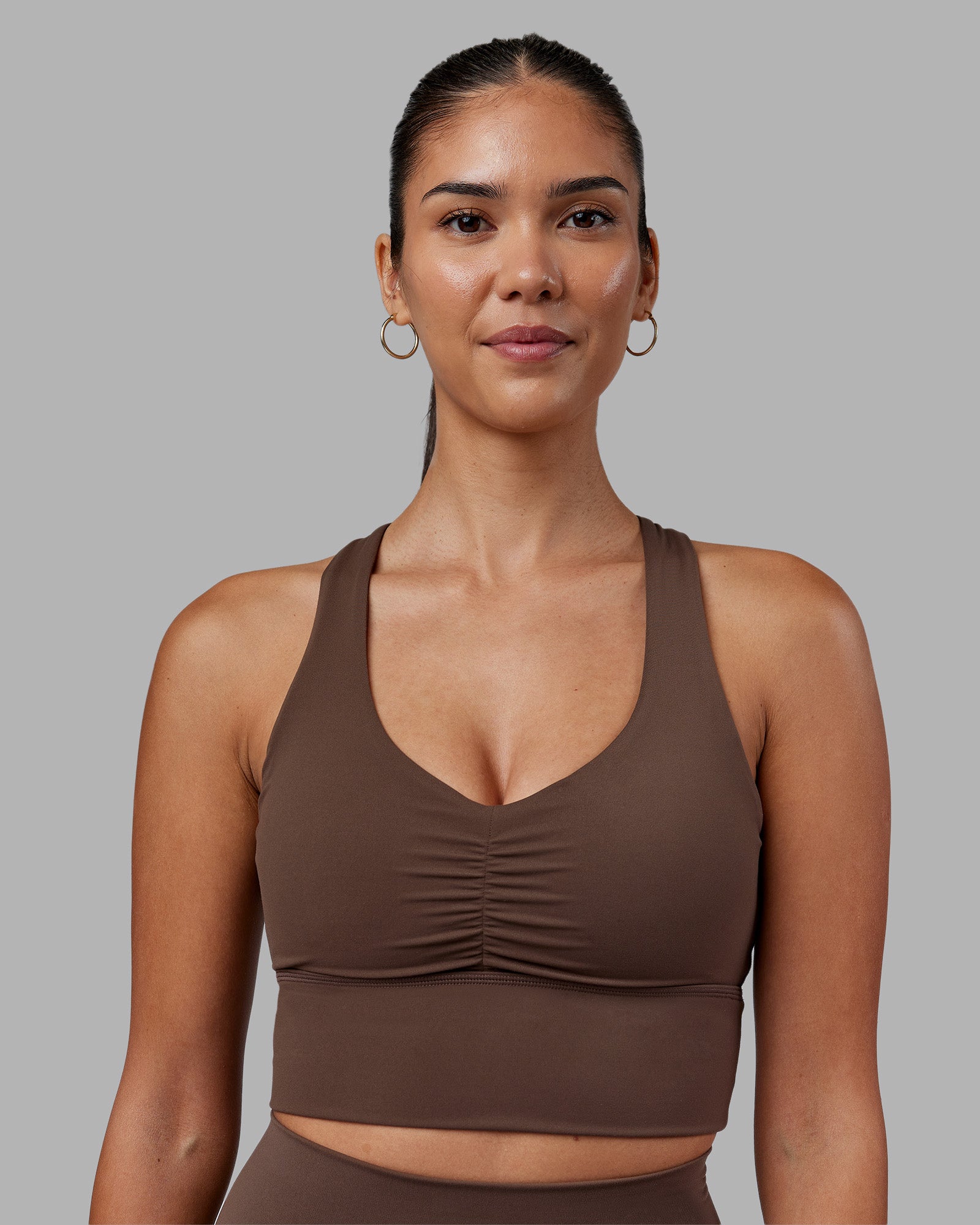 Woman wearing Evoke Longline Sports Bra - Chocolate Martini | Model:Rhiley | Size:S