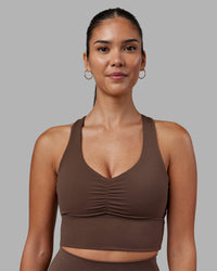 Woman wearing Evoke Longline Sports Bra - Chocolate Martini | Model:Rhiley | Size:S