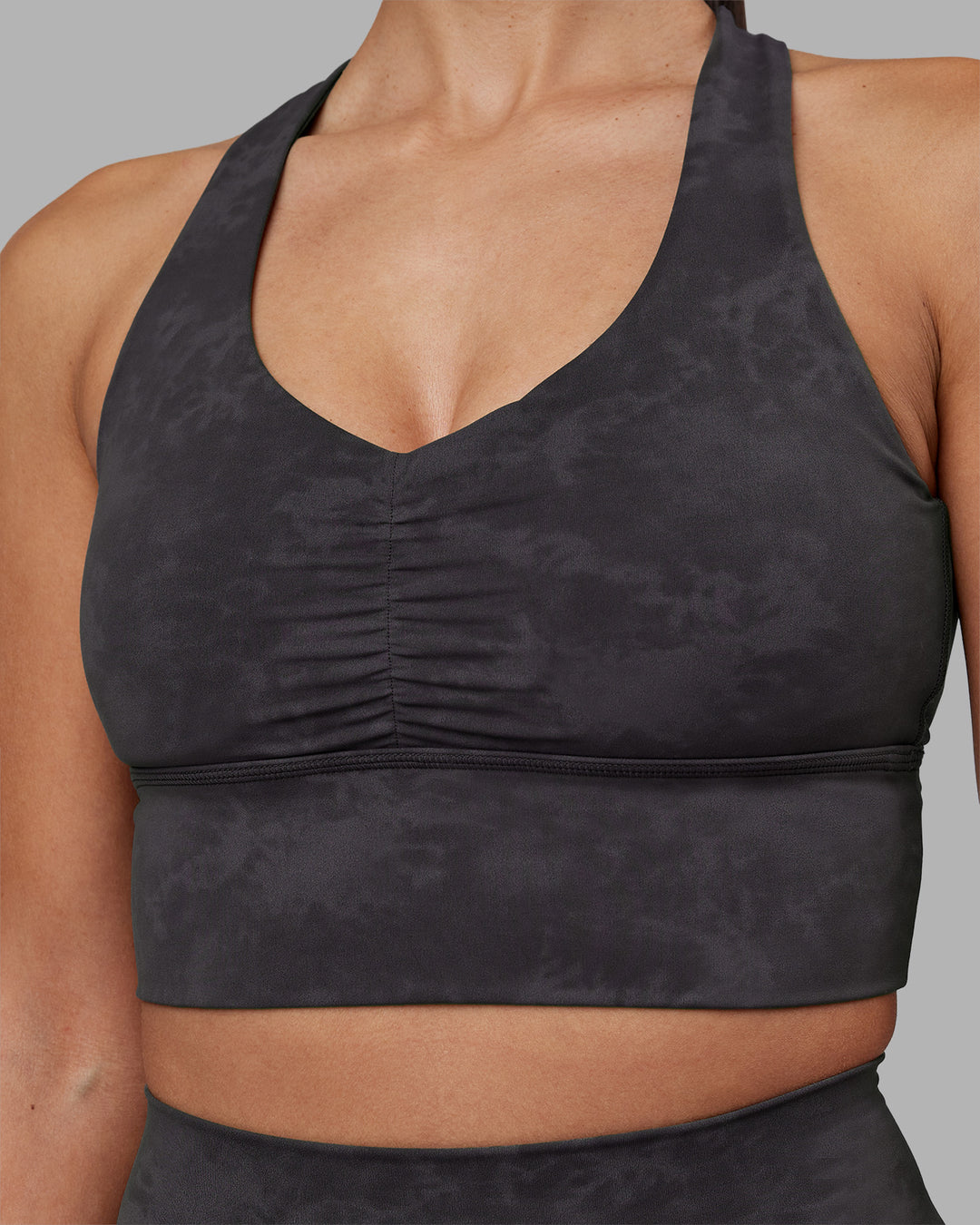 Woman wearing Evoke Longline Sports Bra - Dark Storm Wash | Model:Rhiley | Size:S