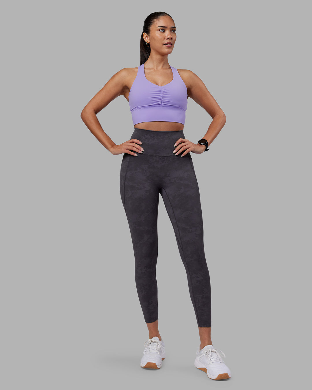 Woman wearing Evoke Longline Sports Bra - Violet Ray | Model:Rhiley | Size:S