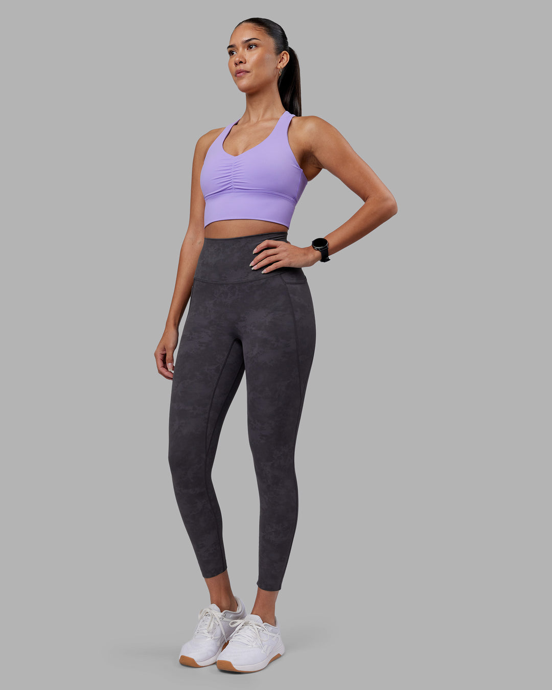 Woman wearing Evoke Longline Sports Bra - Violet Ray | Model:Rhiley | Size:S