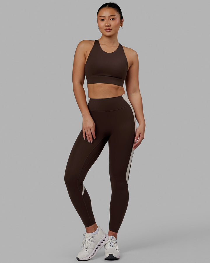 Woman wearing Evolve Full Length Tights - Dark Chocolate