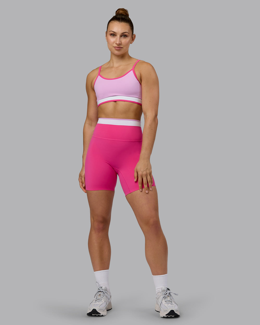 Woman wearing Excel Ultra High-Rise 6&quot; Short - Ultra Pink