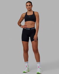 Woman wearing Extend Mid-Rise 6" Short - Black-White