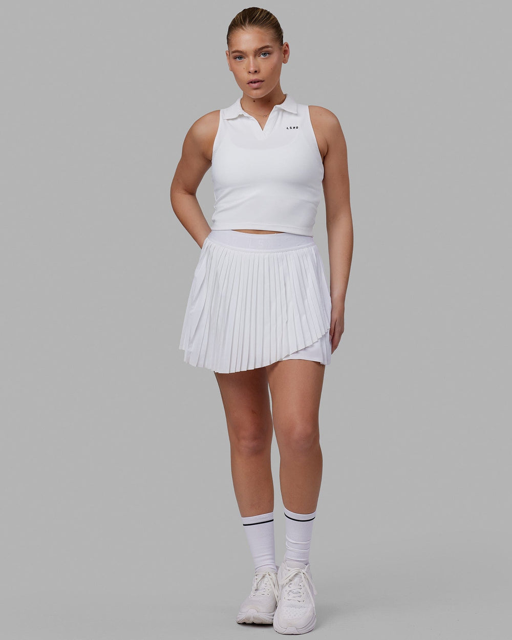 Woman wearing Fairway Collared Tank - White