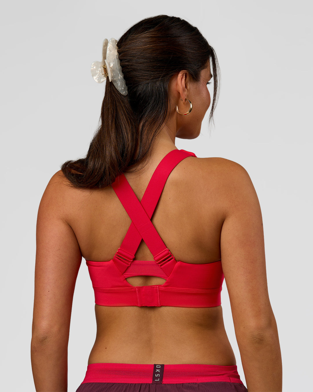 Woman wearing Fast Track Sports Bra Scarlet | Model:Rhiley | Size:S |