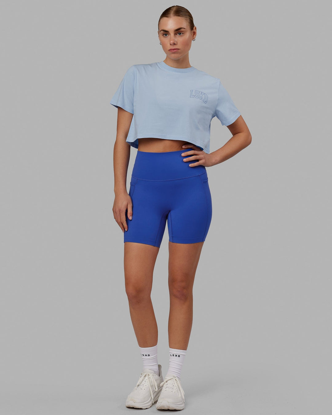 Woman wearing Finish Line Cropped Tee - Windsurfer-Power Cobalt