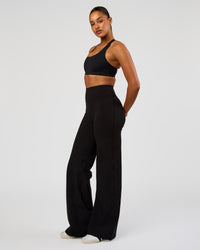 Woman wearing Flow Bonded Scoop Neck Sports Bra - Black | Model:Rosie | Size:S