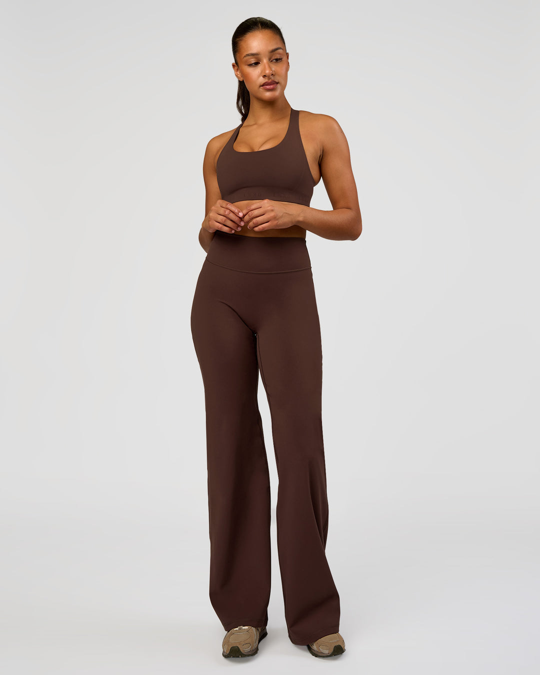 Woman wearing Flow Bonded Scoop Neck Sports Bra - Hot Chocolate | Model:Rosie | Size:S
