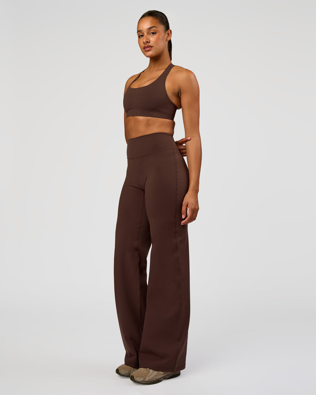 Woman wearing Flow Bonded Scoop Neck Sports Bra - Hot Chocolate | Model:Rosie | Size:S