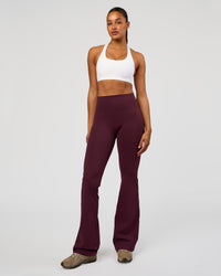 Woman wearing Flow Bonded Scoop Neck Sports Bra - White | Model:Rosie | Size:S