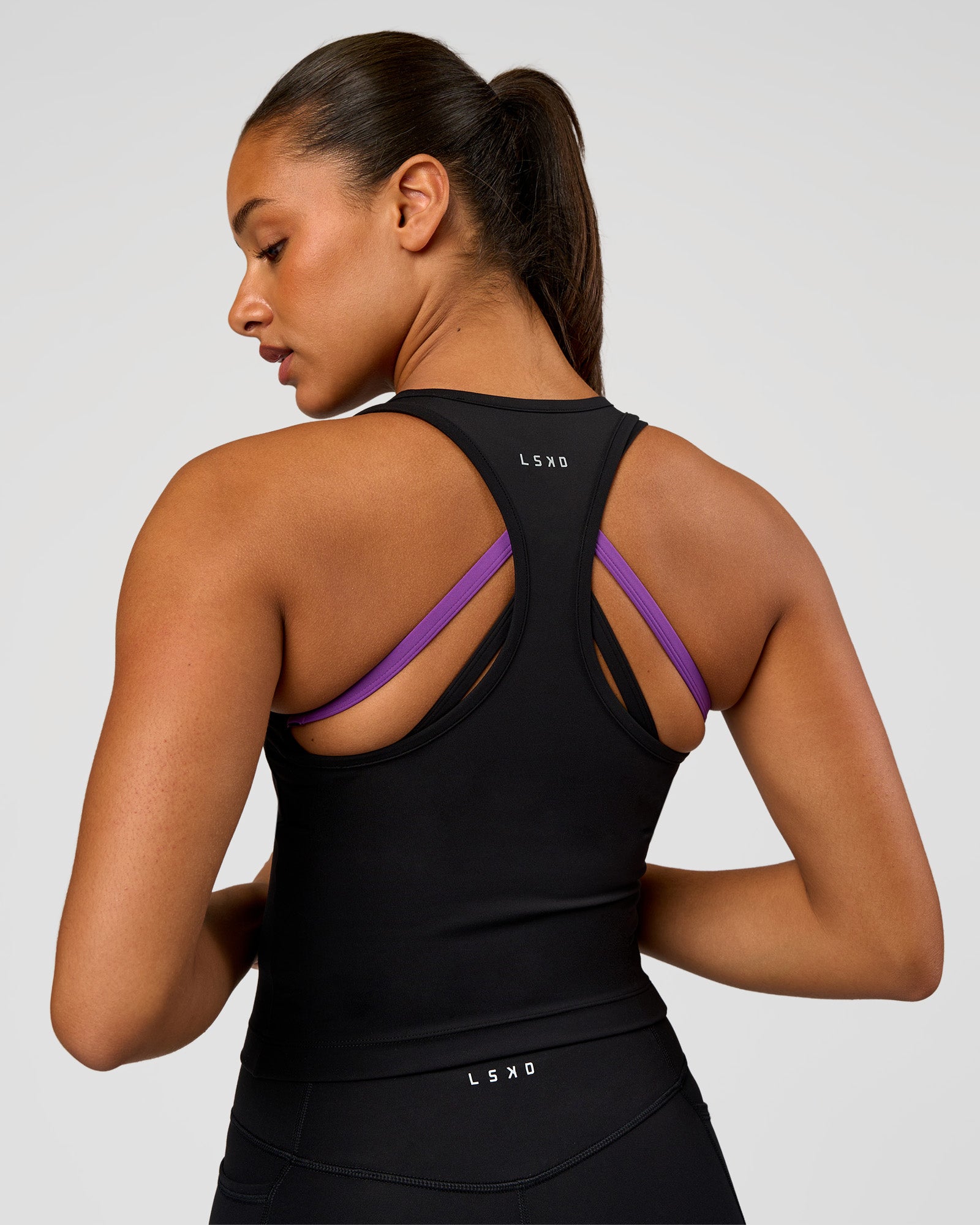 Woman wearing Flow Graphic Performance Tank 2.0 - Black-Radiate | Model:Rosie | Size:S