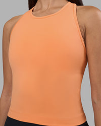Woman wearing Flow Performance Tank 2.0 - Cantaloupe | Model:Rhiley | Size:S