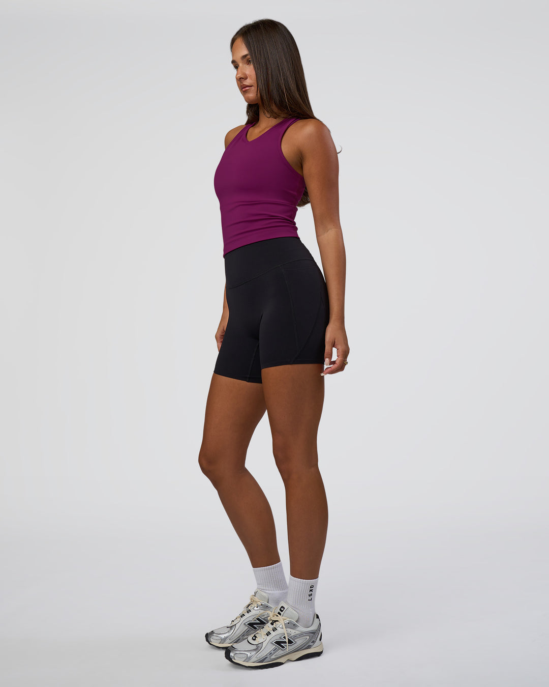 Woman wearing Flow Performance Tank 2.0 - Plum Caspia | Model:Bianca | Size:S