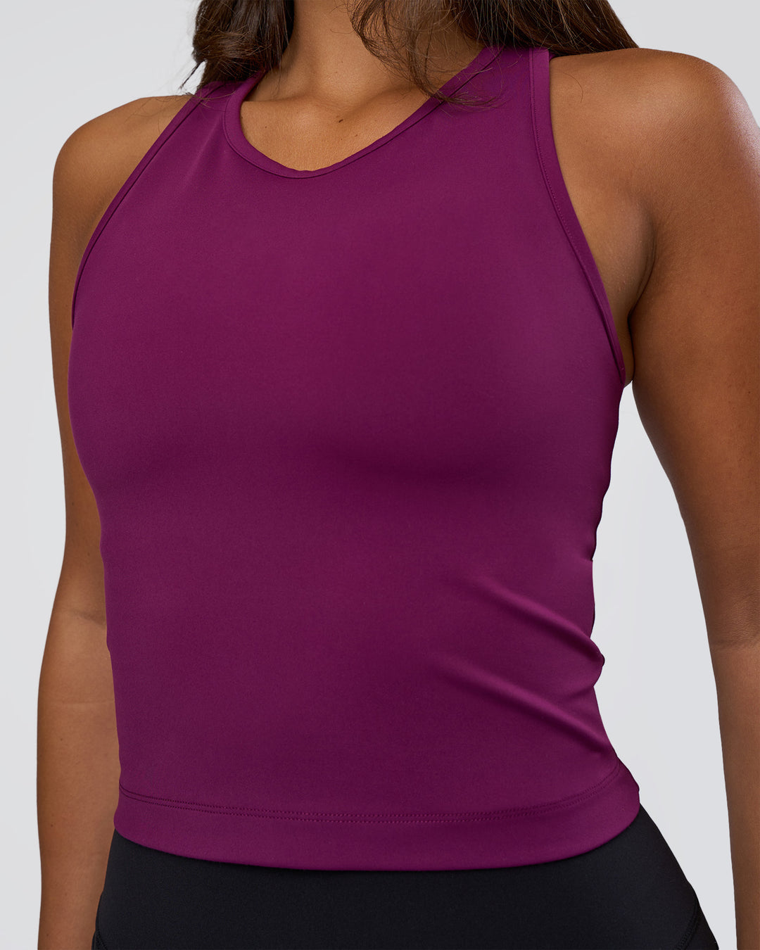 Woman wearing Flow Performance Tank 2.0 - Plum Caspia | Model:Bianca | Size:S