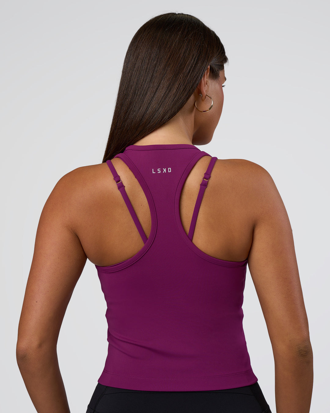 Woman wearing Flow Performance Tank 2.0 - Plum Caspia | Model:Bianca | Size:S