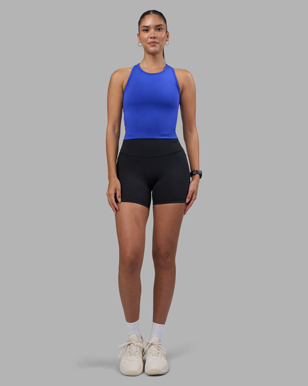 Woman wearing Flow Performance Tank 2.0 - Power Cobalt | Model:Rhiley | Size:S