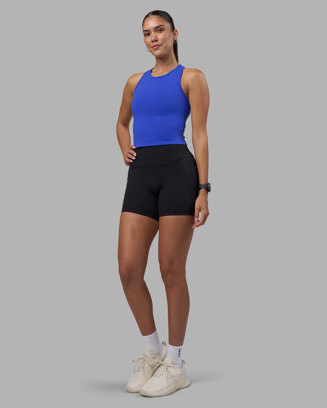 Woman wearing Flow Performance Tank 2.0 - Power Cobalt | Model:Rhiley | Size:S