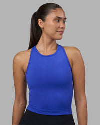 Woman wearing Flow Performance Tank 2.0 - Power Cobalt | Model:Rhiley | Size:S