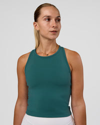 Woman wearing Flow Performance Tank 2.0 - Transformative Teal | Model:Myrte | Size:S