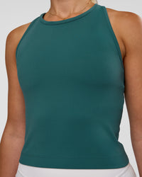 Woman wearing Flow Performance Tank 2.0 - Transformative Teal | Model:Myrte | Size:S