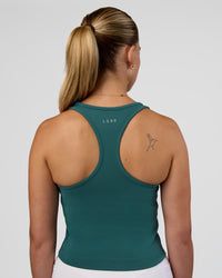 Woman wearing Flow Performance Tank 2.0 - Transformative Teal | Model:Myrte | Size:S